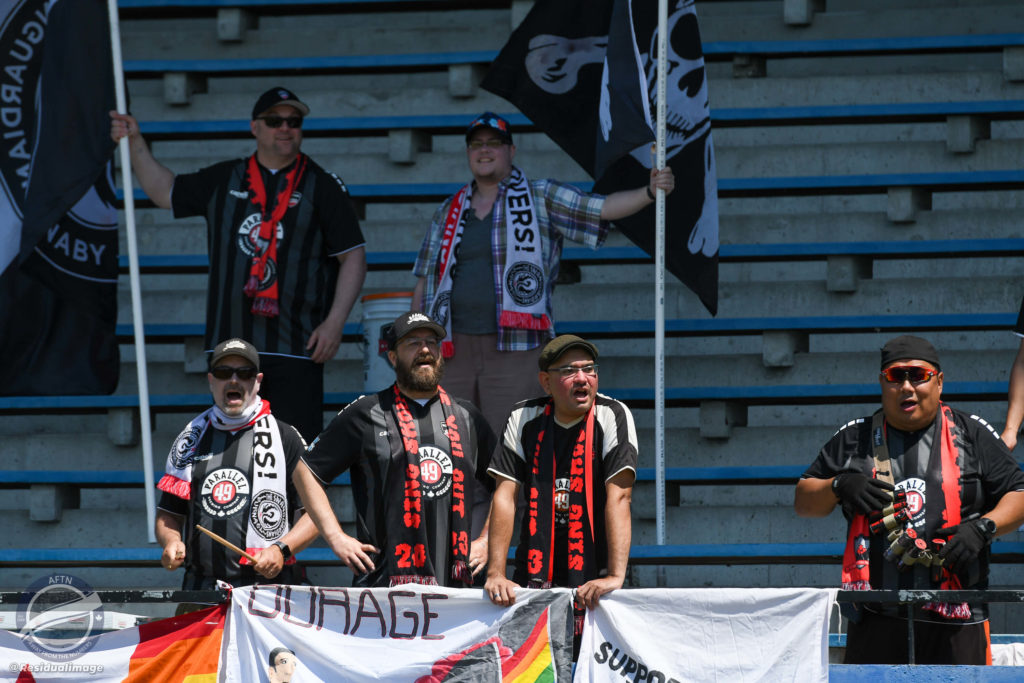 Supporters watch on from the stands