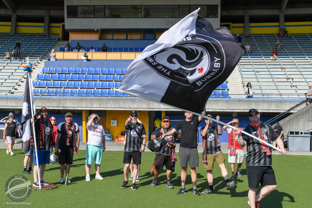 Swanguardians waving flag and celebrating a win