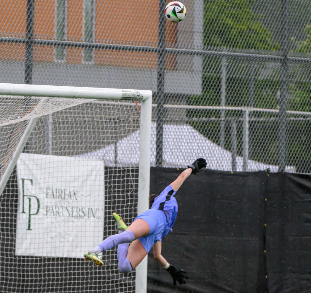 Kirstin Tynan dives to knock the ball over the bar